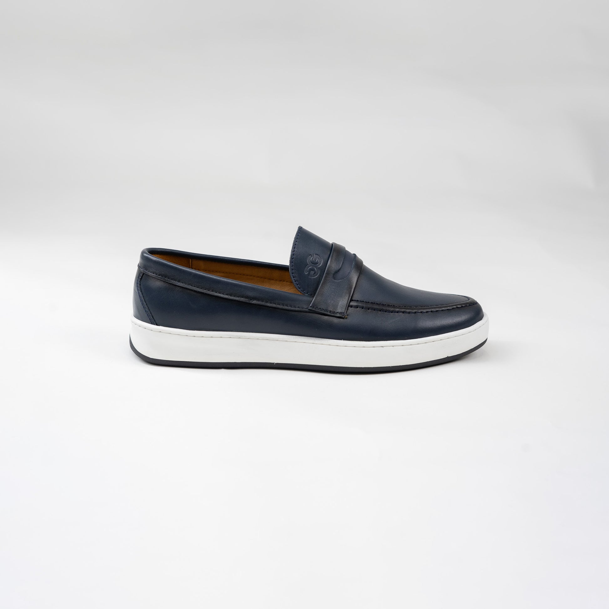 Navy loafer shoe on a white background