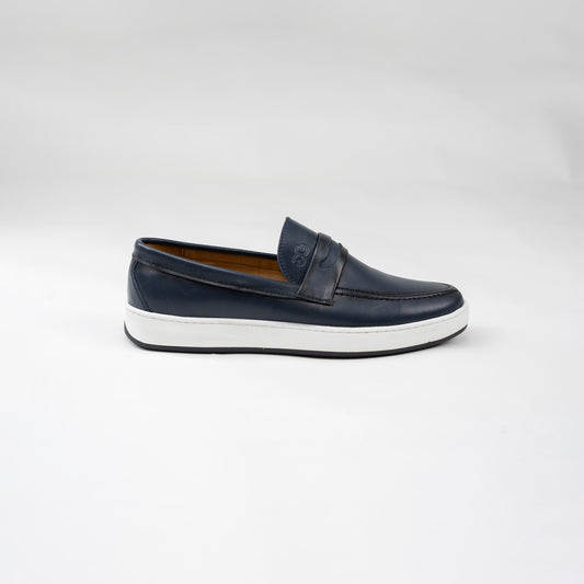 Navy loafer shoe on a white background